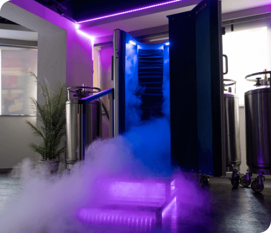 A whole-body cryotherapy chamber softly lit in violet with cold vapour